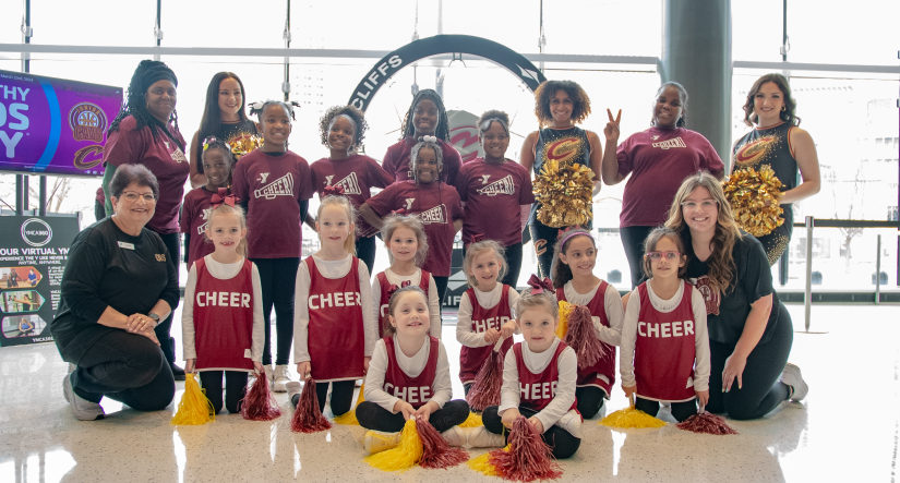 YMCA Cheer Teams take a photo with Cavs Cheer/dance team members