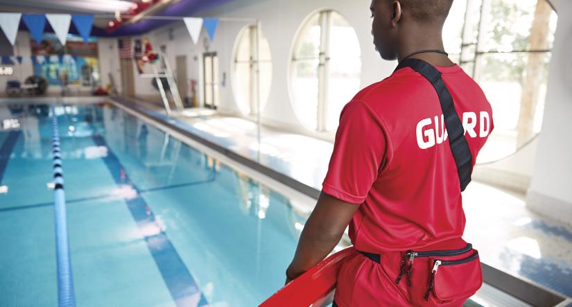 Back of a YMCA life guard on duty 