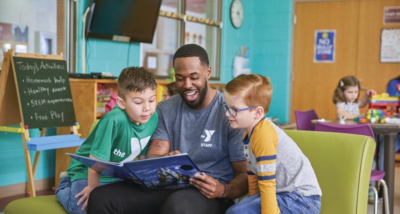 Y-staff member reads to children